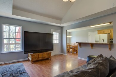 The High Ceiling and Ceiling Fan make the Family room feel more Spacious