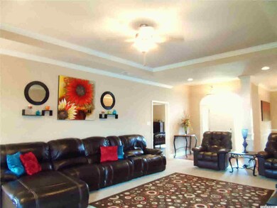 Large great room that looks out onto covered patio and huge back yard