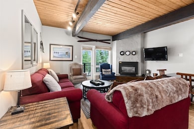 Living room with hardwood / wood-style flooring, t