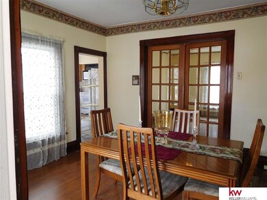 Note beveled glass doors.