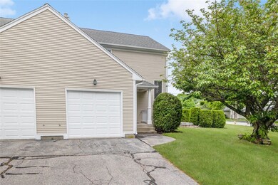 Another view of the town house entrance and it has a one car garage