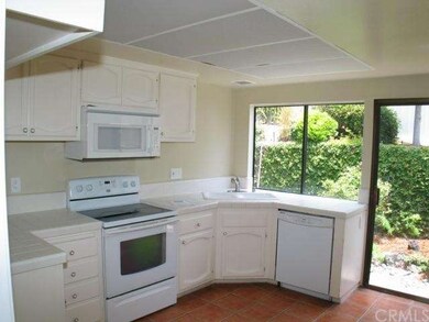 Ceramic Tiled Kitchen with Electric Range and Buil