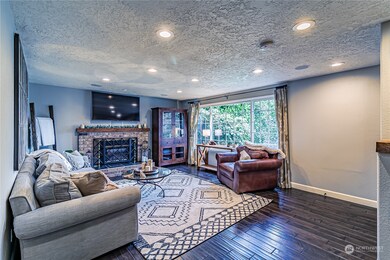 Cozy Living room has open concept and gas fireplace