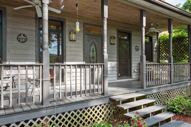 Front covered porch with swing & fans