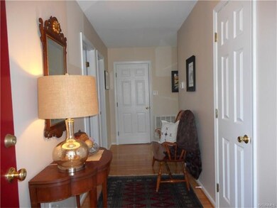 Inviting foyer with hardwood flooring