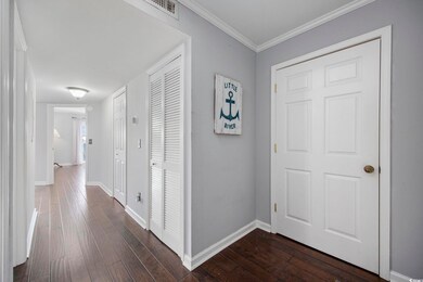 Hall featuring hardwood / wood-style flooring and 