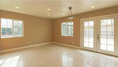 Dining room area with double door entry into back 