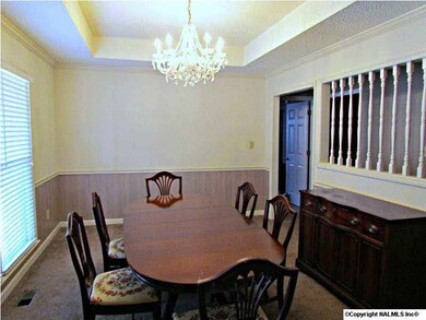 Formal Dining Room has trey ceiling and chair rail