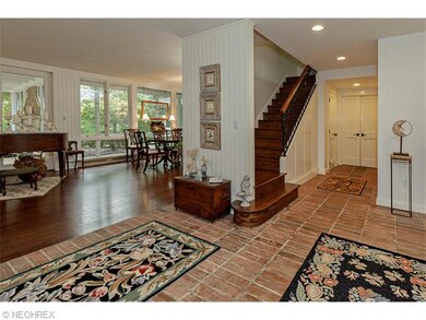 Brick floors, flowing spaces and walls of windows 