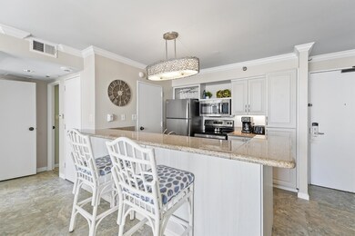 This stylish kitchen features a spacious granite