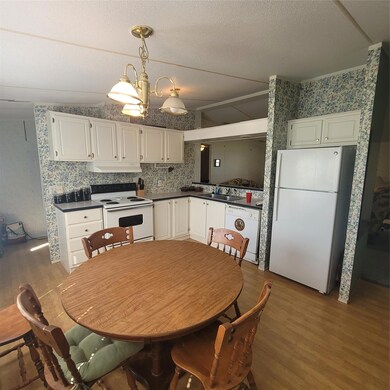 Kitchen featuring fridge, dishwasher, stove, vent