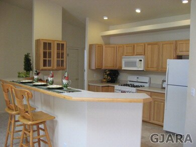 Kitchen has hickory cabinets