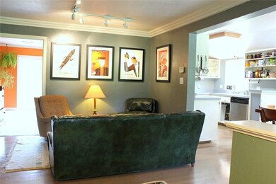 View of the living room into the kitchen.  The mas