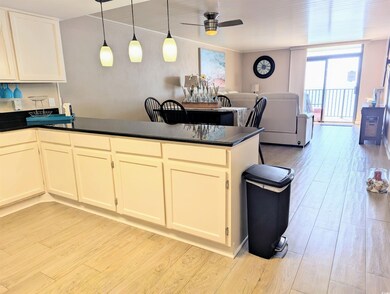 Kitchen featuring light wood-style flooring, a pen
