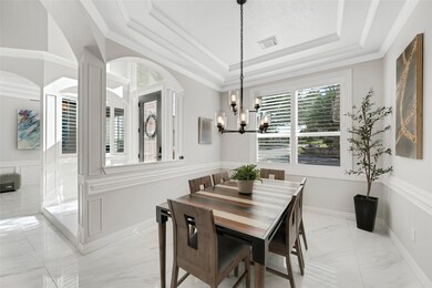Formal Dining at front of house with gorgeous light fixture