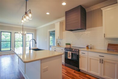 Kitchen with Nickle Joint Hood Range