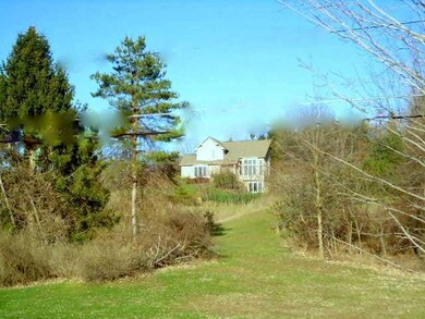 Exterior Front. Private 5.5 Acre Hilltop Setting .