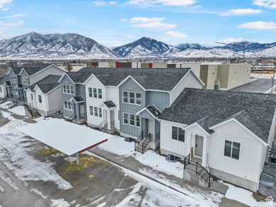 Exterior space featuring a mountain view, a residential view, board and batten siding, and roof with shingles