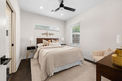 Bedroom featuring recessed lighting, wood finishe