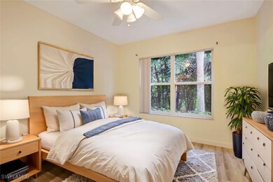 Bedroom with baseboards, ceiling fan, and wood fin