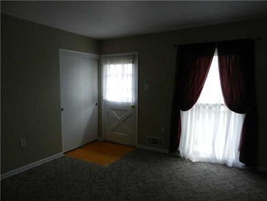 Living Room. ANOTHER VIEW OF THE LIVING ROOM SHOWING DOUBLE ENTRANCE CLOSET, FRONT DOOR AND HARDWOOD FLOORS