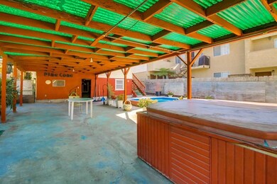 Covered patio in backyard of front house