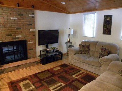 Living room with Vaulted ceiling and Double Faced 