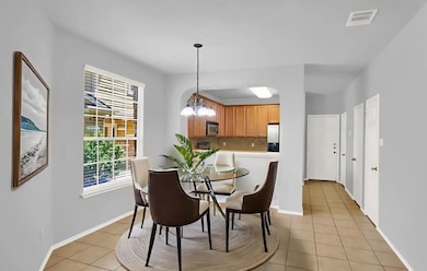 Dining room featuring light tile patterned floors
