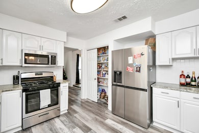 You have easy access to the formal dining and kitc