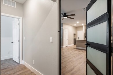 Hallway featuring light wood-style flooring and recessed lighting