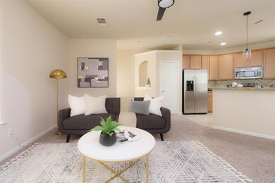 Living area with recessed lighting, baseboards, v
