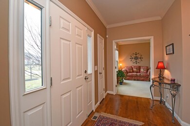 Sidelights grace the front door leading into the E