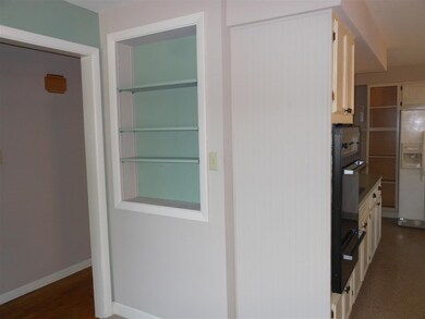 Decorative storage in living room wall.