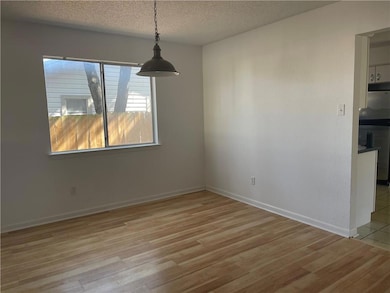 Unfurnished dining area with wood finished floors
