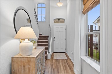 Foyer entrance with plenty of natural light, base