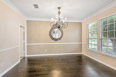 Imagine family and friends gathered around the table during the holidays in your formal dining room with hardwood floors, double crown molding, chair rail and a pretty chandelier.