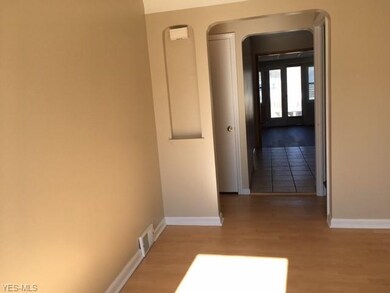 Looking from front door, through kitchen, into fam
