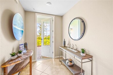 Doorway to outside with baseboards and light tile patterned flooring