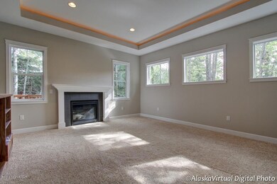 Living room w/ gas FP, custom mantle . .