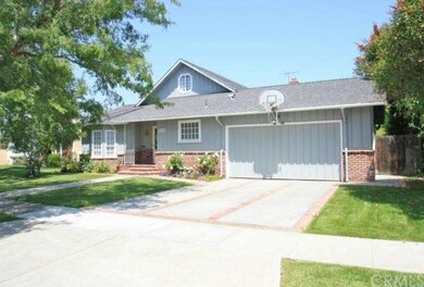 Featuring 2 Car attached garage and brick trim