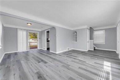 Unfurnished living room with light hardwood floors