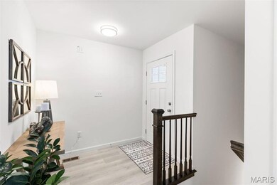 Foyer entrance with light hardwood / wood-style floors