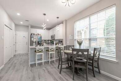 Dining space with baseboards, light wood finished