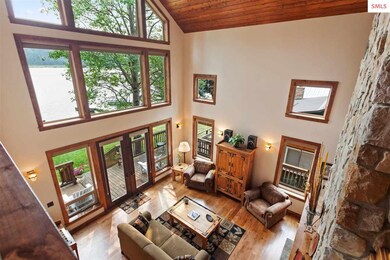 Two-story windows flood this home with abundant li