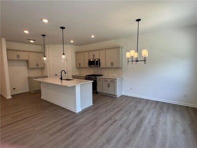 Open Floor Plan Concept with Designer Kitchen, Dining Area, & Fireside Family Room