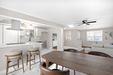 Dining area featuring a wealth of natural light, s