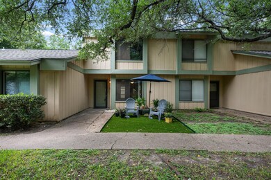 View of front of property featuring roof with shi