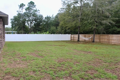 fenced-in back yard