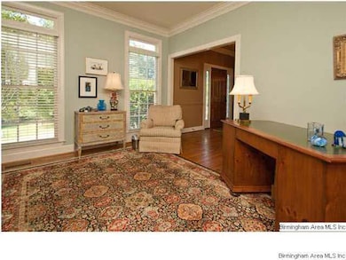 Living room with floor to ceiling windows.  Curren