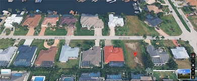 Aerial overview of property's location with nearby suburban area and a nearby body of water